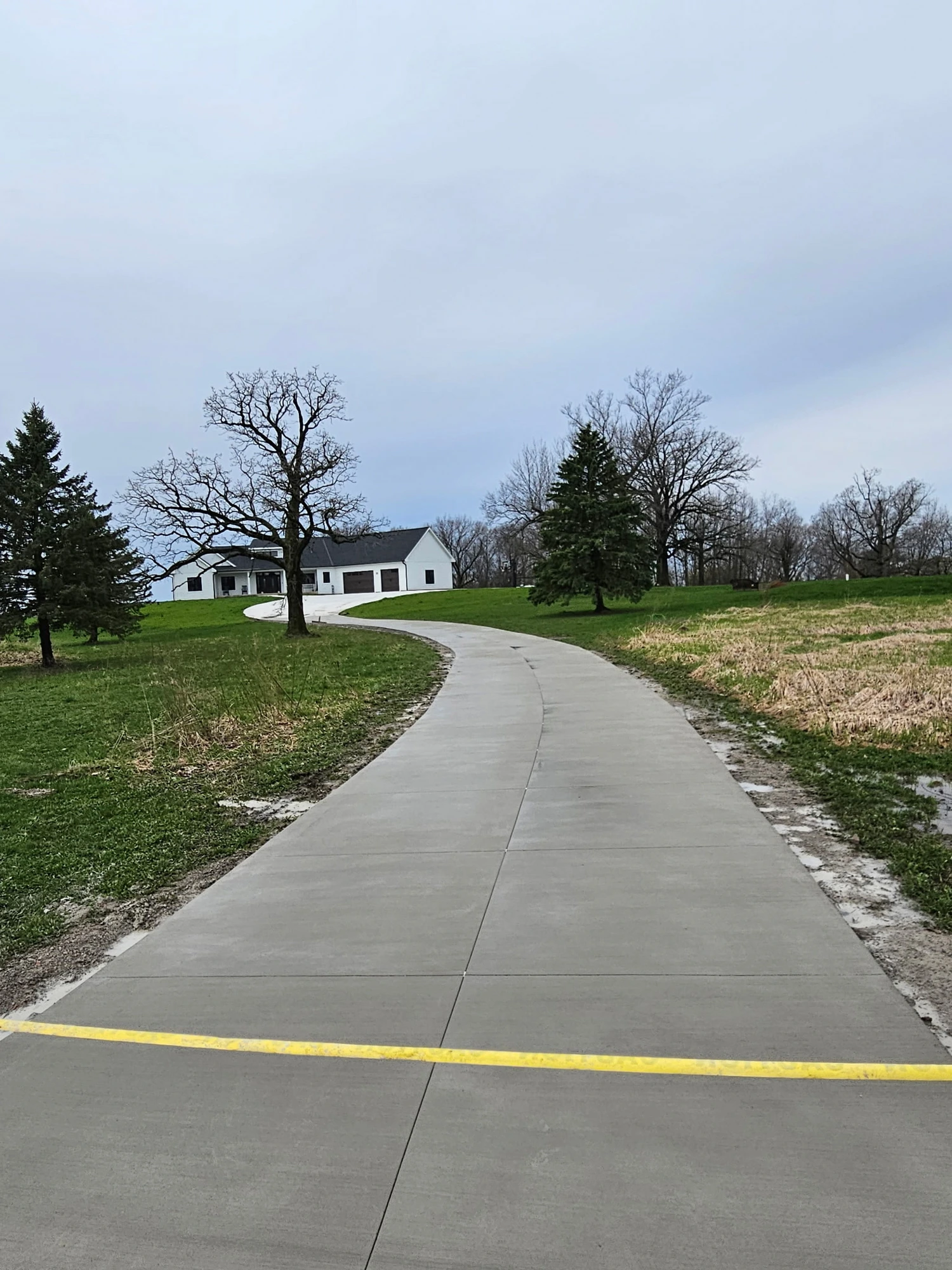 Ribbon Driveway to Hilltop Home